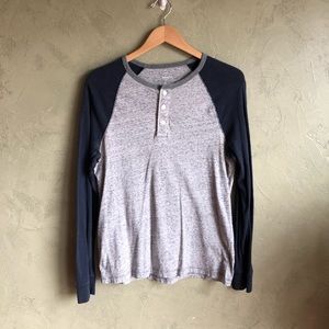 Navy blue and heather grey long sleeve shirt.